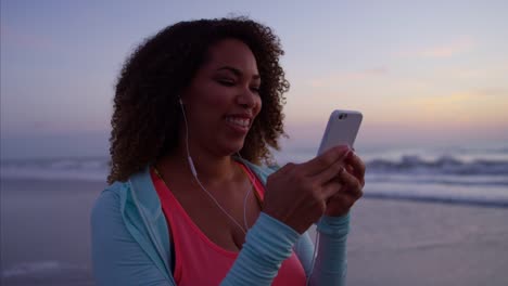 Ethnic-female-gentle-fat-burning-exercise-at-sunrise