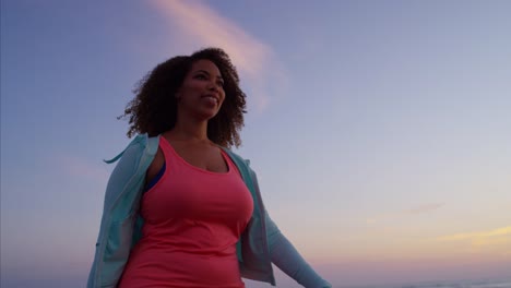 African-American-female-gentle-workout-with-smart-phone