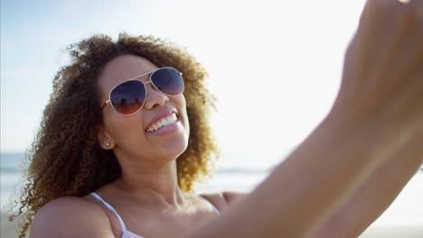 African-American-female-taking-photo-with-smart-phone