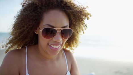 Ethnic-female-texting-with-smart-phone-on-vacation