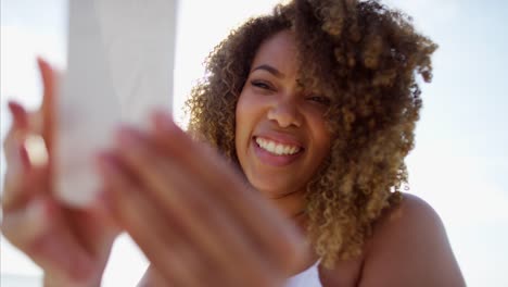 African-American-female-waving-farewell-using-video-messaging