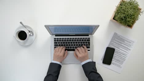 Man's-Hands-Working-on-the-Laptop