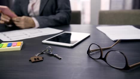 Dolly-shot-of-real-estate-concept-with-house-keys