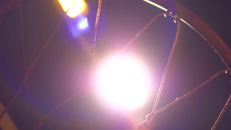 An-outdoor-basketball-hoop-at-night