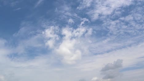 Dramatic-atmosphere-panorama-view-4K-Time-lapse-footage-video-clip-of-blue-sky-and-clouds-on-beautiful-summer-day.