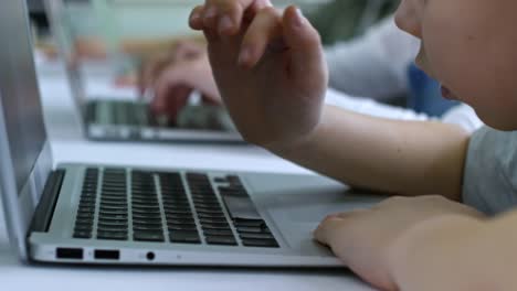 Little-Boy-Typing-on-Laptop-Computer