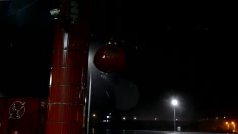 Awning-and-Chinese-lantern-blowing-in-typhoon-water-and-rain