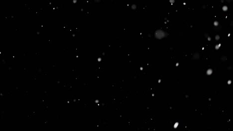 White-Snow-Falling-on-Isolated-Black-Background