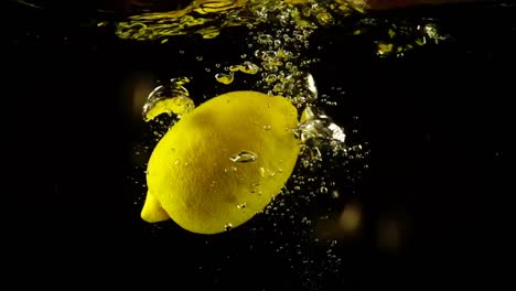 Falling-of-a-lemon-in-water.-Slow-motion.