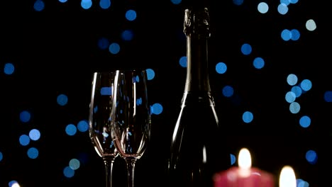 Romantic-candles-on-a-table-with-two-glasses