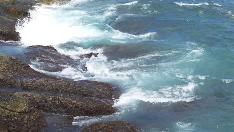 Foaming-and-splashing-wave-in-the-Ocean-with-slow-motion-style,-Sunny-Day-in-Chaojing-Park,-Keelung-City-Taiwan