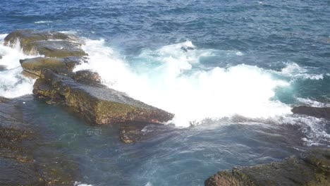 Foaming-and-splashing-wave-in-the-Ocean-with-slow-motion-style,-Sunny-Day-in-Chaojing-Park,-Keelung-City-Taiwan