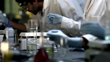 Close-up-of-experiments-being-conducted-in-a-chemistry-lab