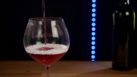 Red-wine-is-poured-into-a-glass