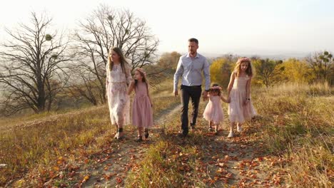 Family-walking-on-a-hill