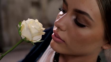 Close-up-shot-of-sexy-woman-lips-with-lipstick-and-beautiful-white-rose-sensual