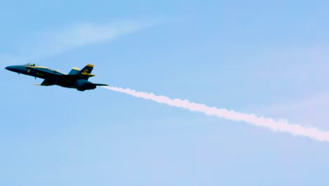 blue-angel-streaks-across-sky-turns-into-barrel-roll