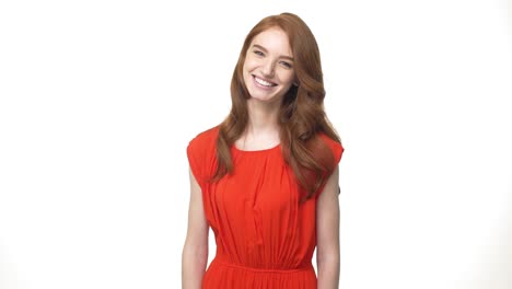 Young-beautiful-caucasian-woman-in-gorgeous-orange-dress-standing-and-say-no-isolated-over-white-background-while-looking-camera.