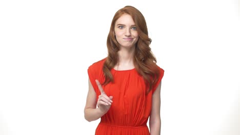 Young-beautiful-caucasian-woman-in-gorgeous-orange-dress-standing-and-say-no-isolated-over-white-background-while-looking-camera.