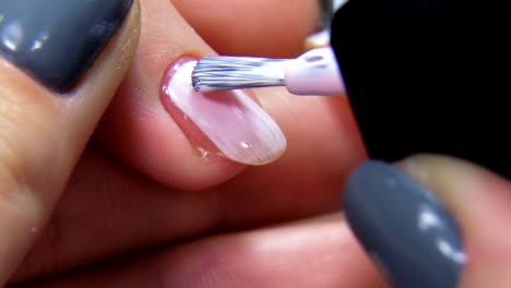 Professional-manicure-procedure-in-beauty-salon-slowmotion.