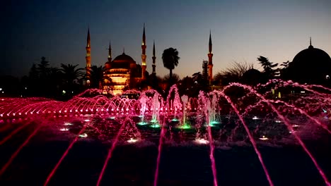 Illuminated-Sultan-Ahmed-Mosque-Blue-Mosque-before-sunrise,-View-of-the-evening-fountain.-Istanbul,-Turkey