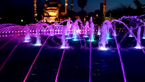 Illuminated-Sultan-Ahmed-Mosque-Blue-Mosque-before-sunrise,-View-of-the-evening-fountain.-Istanbul,-Turkey