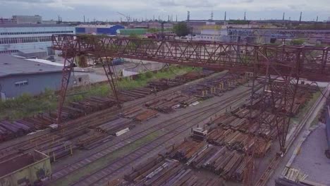 The-gantry-crane-moves-above-the-metal-warehouse