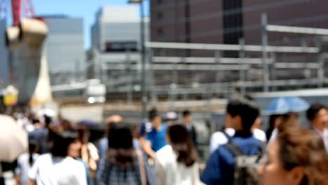 Anonymous-crowd-of-people-walking-on-walk-way