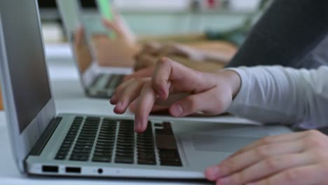 Hands-of-Child-Typing-on-Laptop-Computer