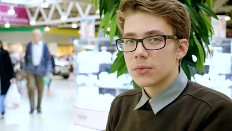 Portrait-of-a-young-man-in-a-mall.