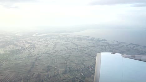 View-from-the-window-of-the-plane-flying-over-gulf-of-Thailand