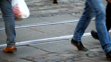 Crosswalk.-People-cross-the-street-at-a-pedestrian-crossing-in-a-big-city.-Cars-stopped-at-a-traffic-light.