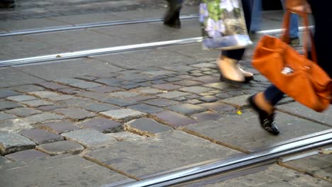 Crosswalk.-People-cross-the-street-at-a-pedestrian-crossing-in-a-big-city.-Cars-stopped-at-a-traffic-light.