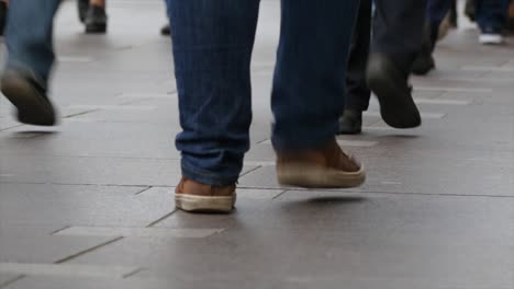 Feet-of-people-walking-on-the-city-street