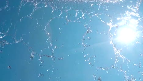 Water-coming-down-in-the-sun-(slow-motion)