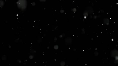 White-Snow-Falling-on-Isolated-Black-Background