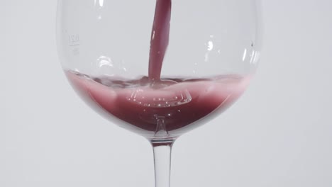 Mauve-Colored-Liquid-Into-Wine-Glass