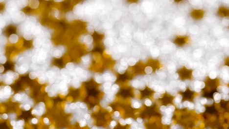 Sparkling-glitter-in-the-shape-of-a-star.-Close-up-on-a-silver-background