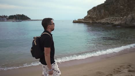 Lonely-guy-on-a-beach-walk.