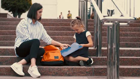 European-mother-and-daughter-are-preparing-for-school-classes