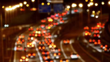 Highway-Traffic-Cars-Driving-at-Multiple-Lane-Speedway-at-Night-Blurred