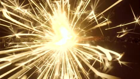 Firework-sparkler-burning-on-black-background