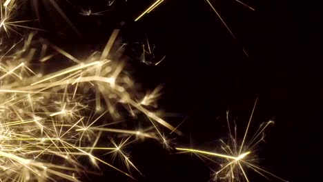 Firework-sparkler-burning-on-black-background