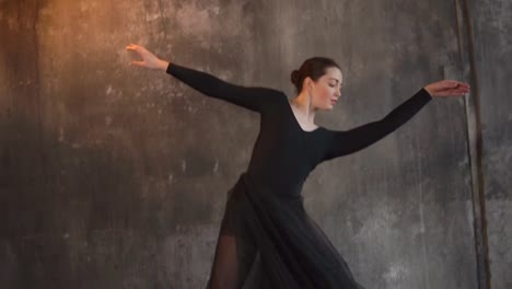 Modern-ballerina-is-dancing-and-playing-with-her-black-fatine-skirt