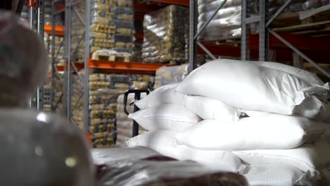 Raw-goods-in-industrial-warehouse---sugar-inside-a-large-storage