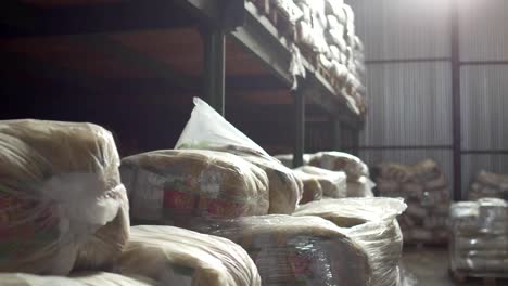 Shelves-of-cardboard-boxes-inside-a-storage-food-warehouse