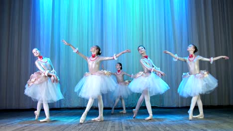 ballet-rehearsal,-on-the-stage-of-the-old-theater-hall.-Young-ballerinas-in-elegant-dresses-and-pointe-shoes,-dance-elegantly-certain-ballet-motions,-pass,-scenic-bow