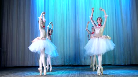 ballet-rehearsal,-on-the-stage-of-the-old-theater-hall.-Young-ballerinas-in-elegant-dresses-and-pointe-shoes,-dance-elegantly-certain-ballet-motions,-pass,-scenic-bow