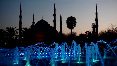 Illuminated-Sultan-Ahmed-Mosque-Blue-Mosque-before-sunrise,-View-of-the-evening-fountain.-Istanbul,-Turkey