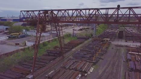 The-gantry-crane-moves-above-the-metal-warehouse